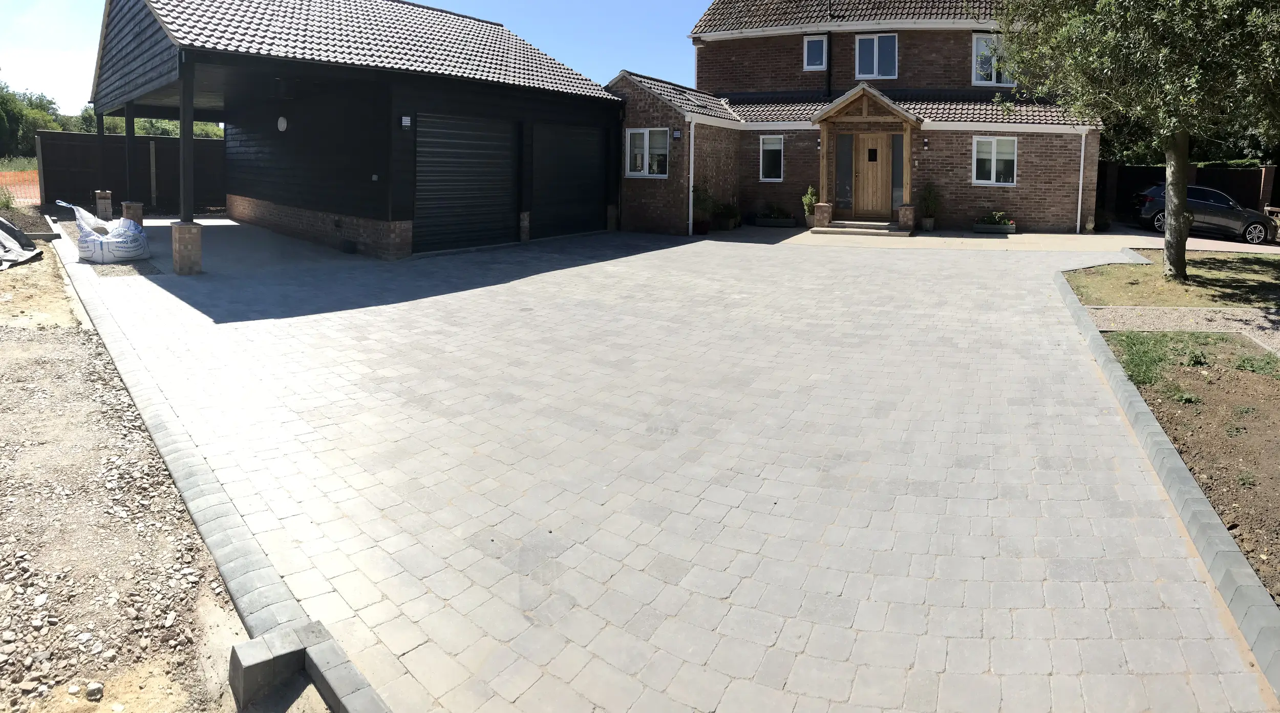 Completed paved driveway and garage area